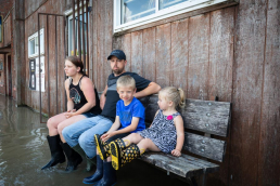 Owners of Mokane Bar and Grill with their children after the Mid Missouri Flooding