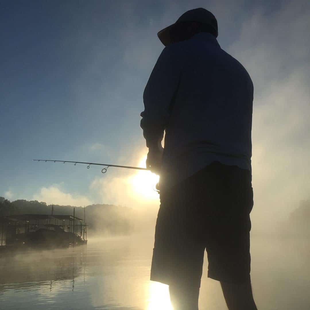 Bass fisherman on Lake of The Ozarks in the Missouri Sunrise