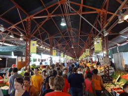 Missouri Farmers Market and Trade Center with people gathered under pavillion.