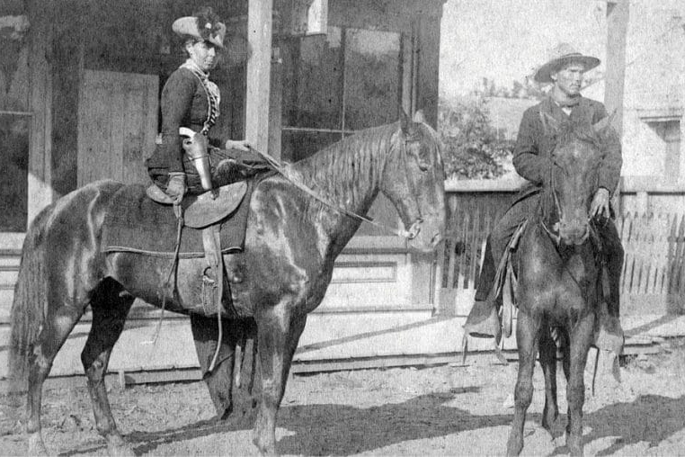 Belle starr Fort Smith on a horse with a pistol. Public domain