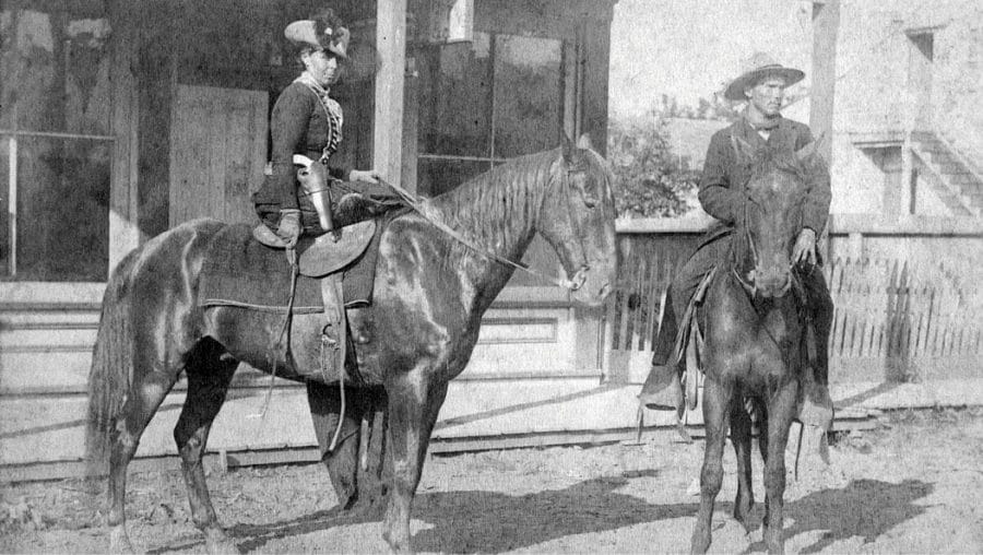 Belle starr Fort Smith on a horse with a pistol. Public domain