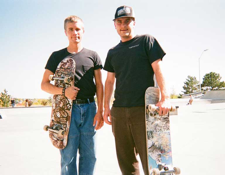 The Epple brothers pose with their skateboards.
