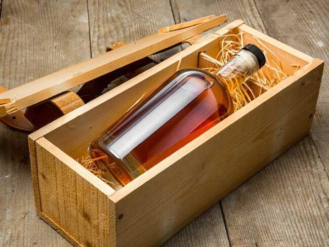 Bottle of whiskey in wooden box