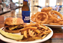 Comfort food classics like the bacon cheddar burger with hand-cut fries and onion rings at The Kozy in Bloomfield.