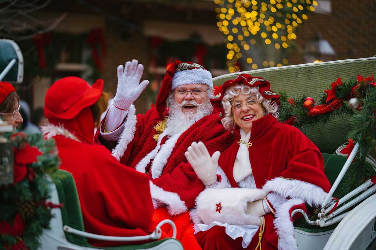 Missouri Division of Tourism photo of Santa and Mrs. Claus waving during a parade. MDT photo.