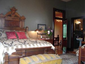 The Whiskey Mansion bedrooms are comfy with a yesteryear feel and appearance.