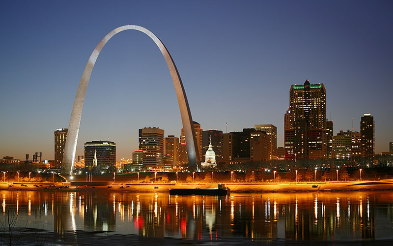St. Louis Arch and Missouri River in the night with the downtown skyline
