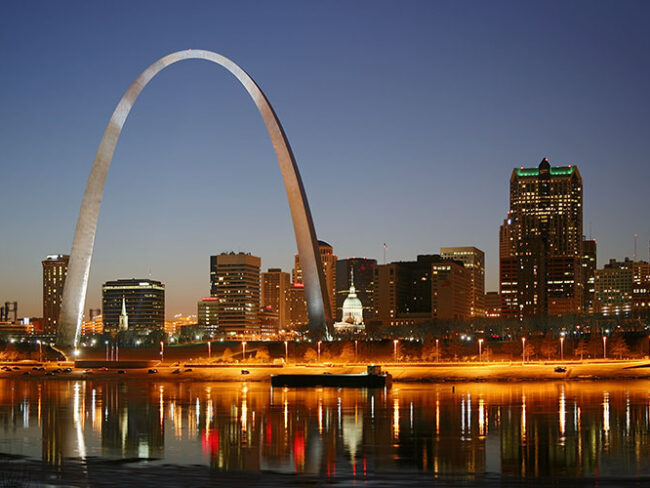 St. Louis Arch and Missouri River in the night with the downtown skyline