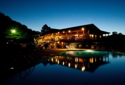 Nightime view of lake house in Bass River Resort