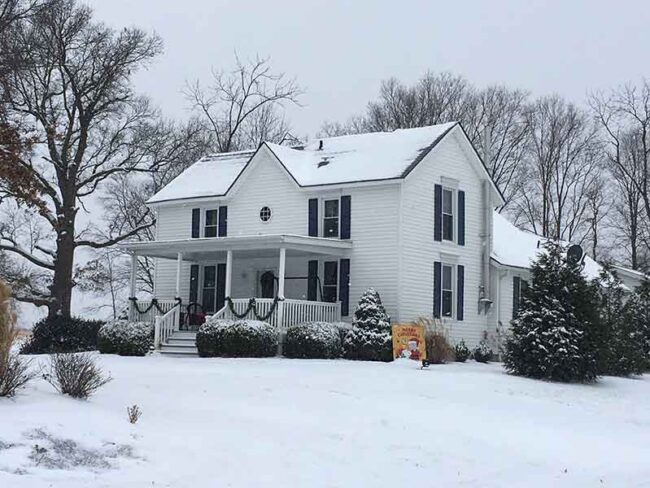 Home covered in snow located outside of Haha Tonka State Park - Missouri Travel Destination