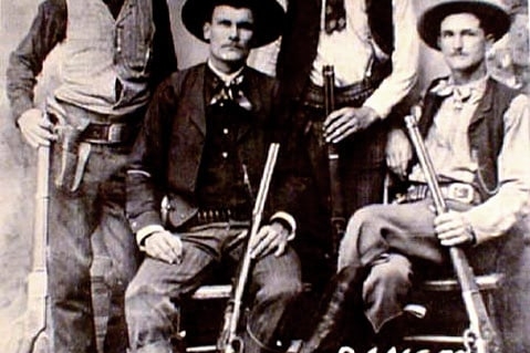 The James Gang posing with shotguns and rifles