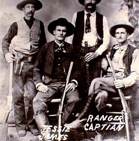 The James Gang posing with shotguns and rifles