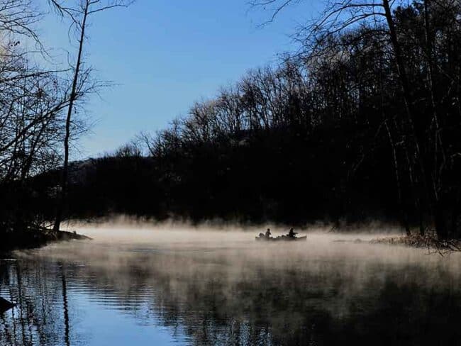 A misty morning for fisherman on Lake of The Ozarks in Ha Ha Tonka State Park