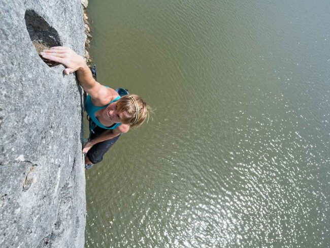 Climber is sending on rock over Missouri waters