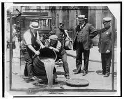 people dumping out liquor into the streets during the Missouri Prohibition of alcohol