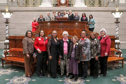 Missouri women senators, past and present, pose for a photo in the Senate chamber.