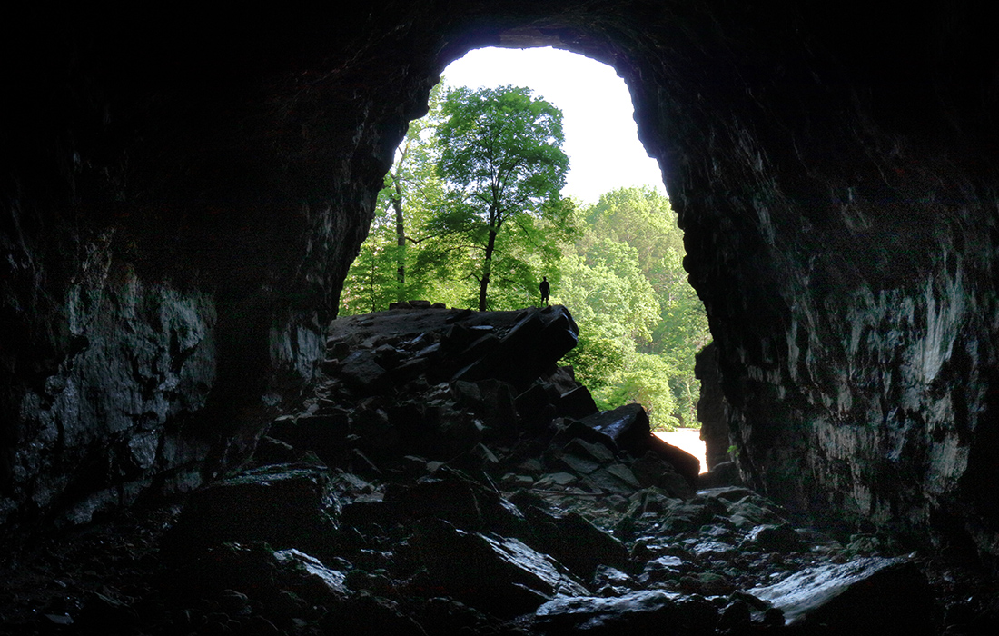 Man at the entrance of Jam Up Cave