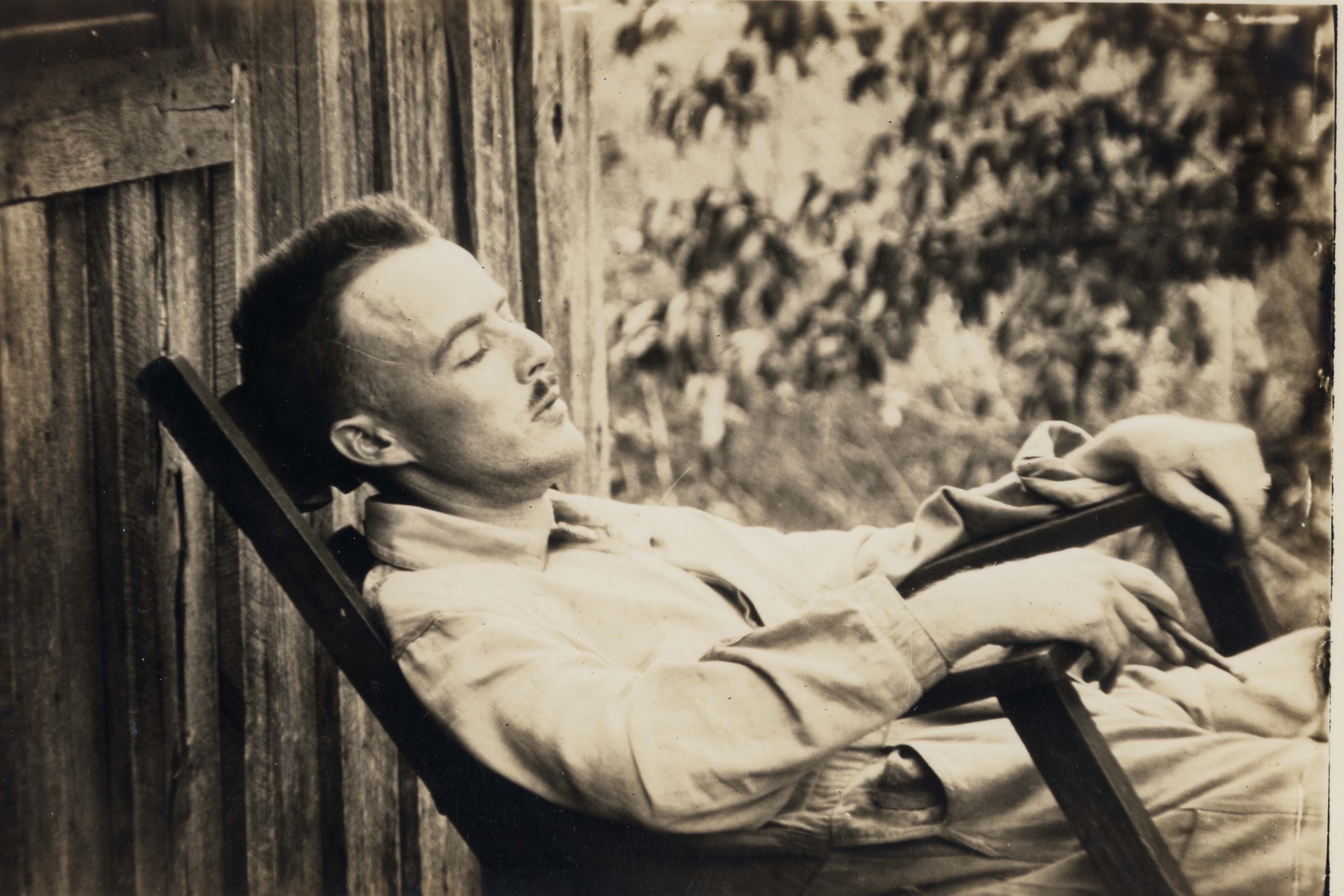 Vance Randolph on a porch in Pineville, Missouri